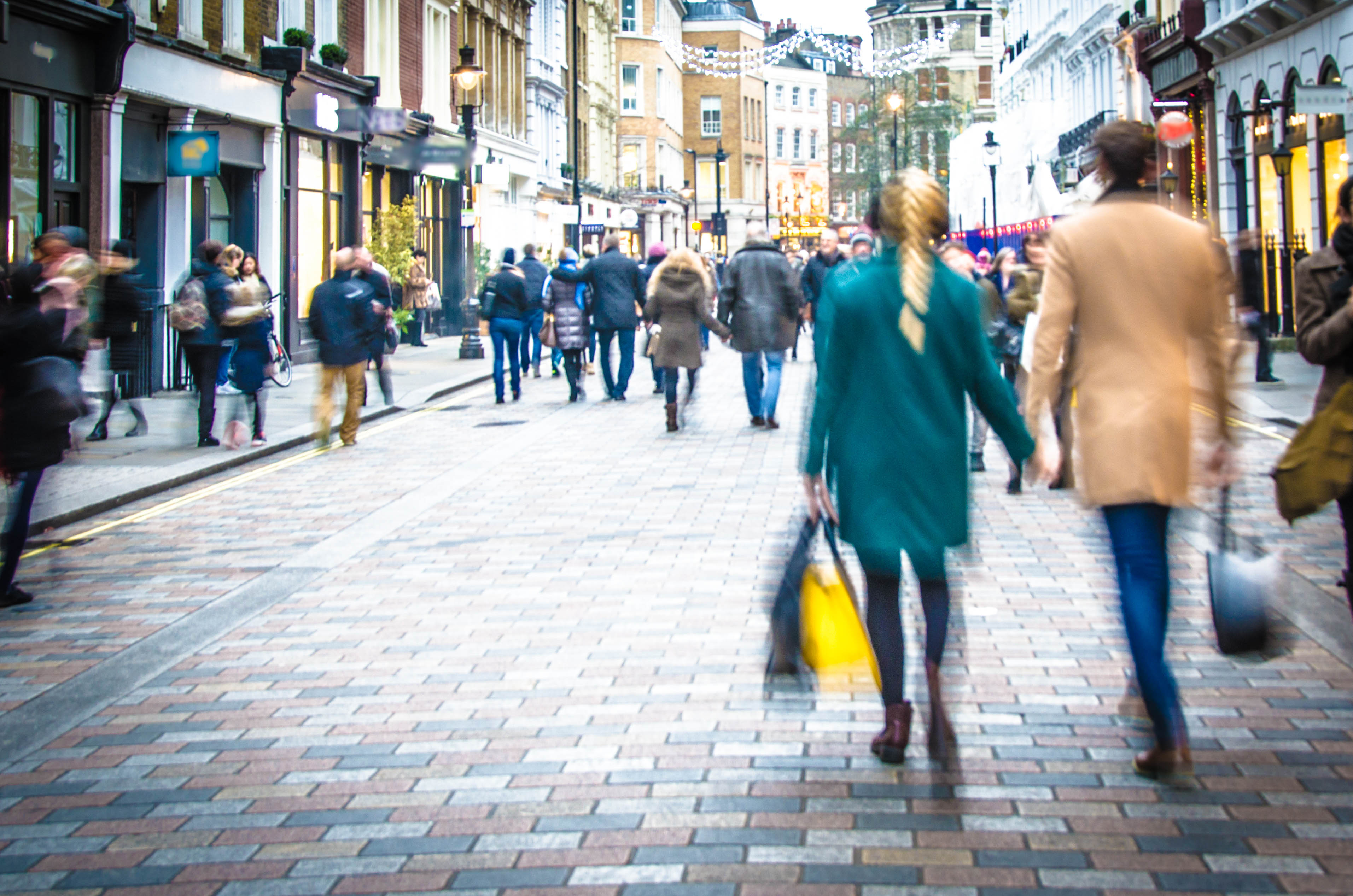 A blurry image of a retail street