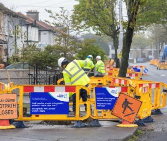 Uisce Éireann workers working on a residential street
