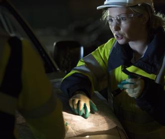An engineer pointing at a map